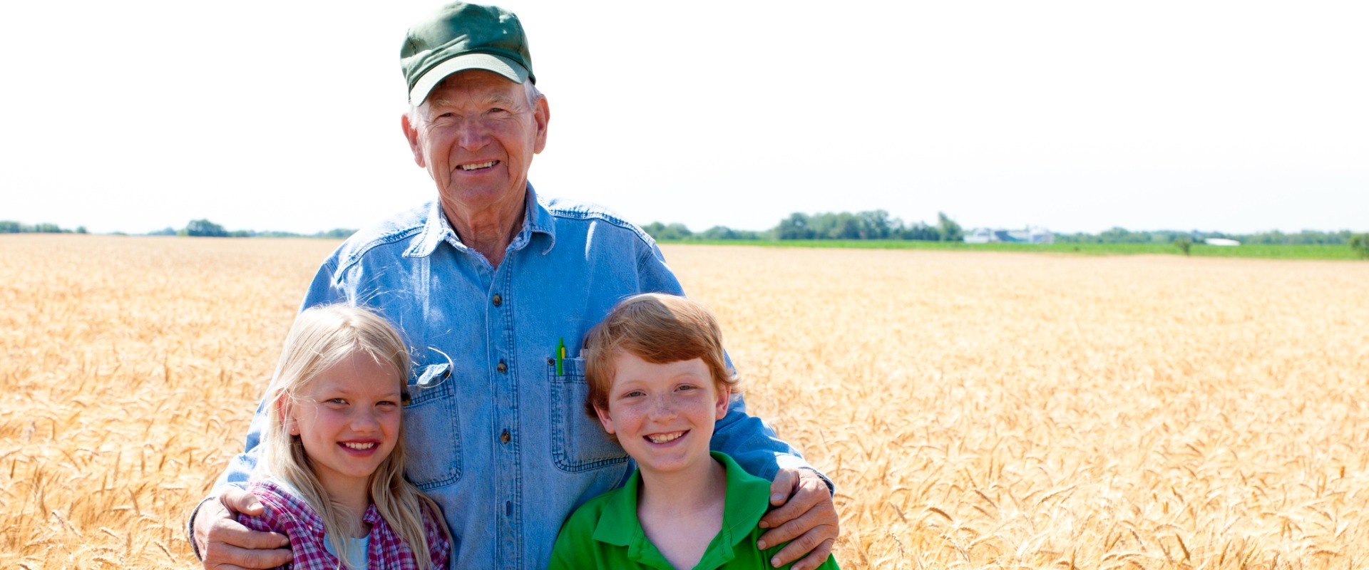 Grandfather farmer with grandchildren